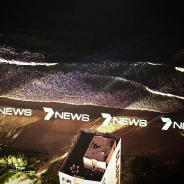 7 news logo projected onto surfers paradise beach from the top of q1 building